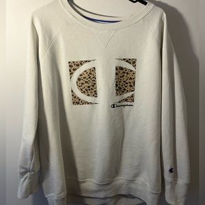 champion crew neck with cheetah print.